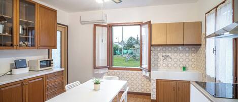 Fridge, microwave, stovetop, coffee/tea maker