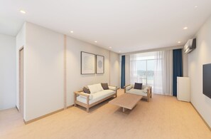 Suíte, 1 quarto, piscina particular, vista para o oceano | Área de estar