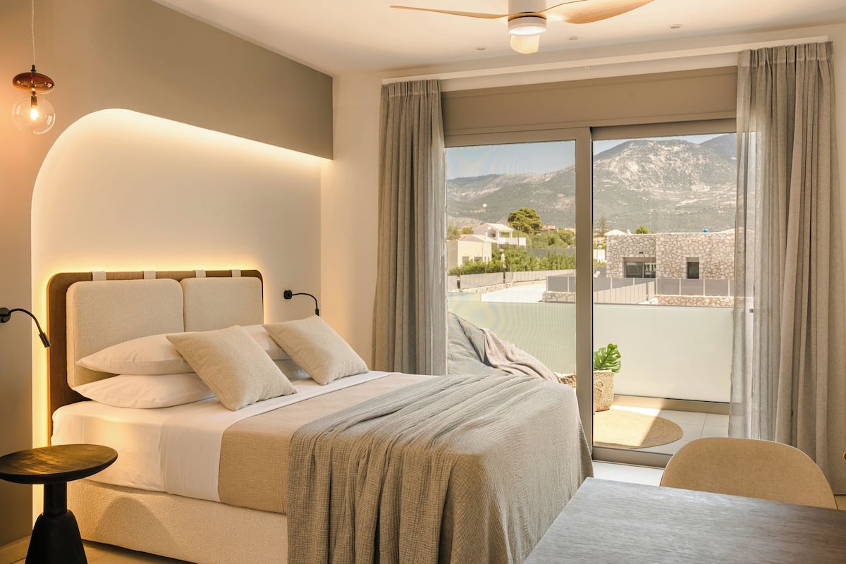 Junior Suite, Balcony, Pool View | In-room safe, iron/ironing board, free WiFi