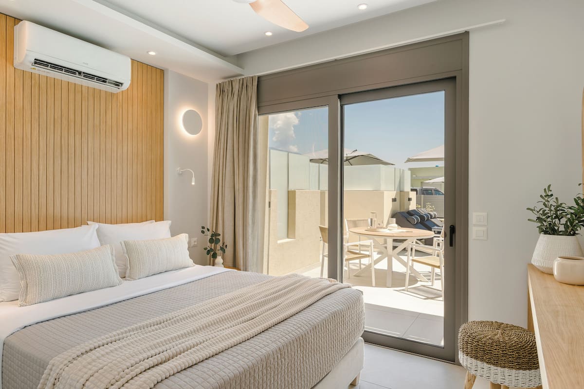 Superior Suite, Balcony, Pool View | In-room safe, iron/ironing board, free WiFi