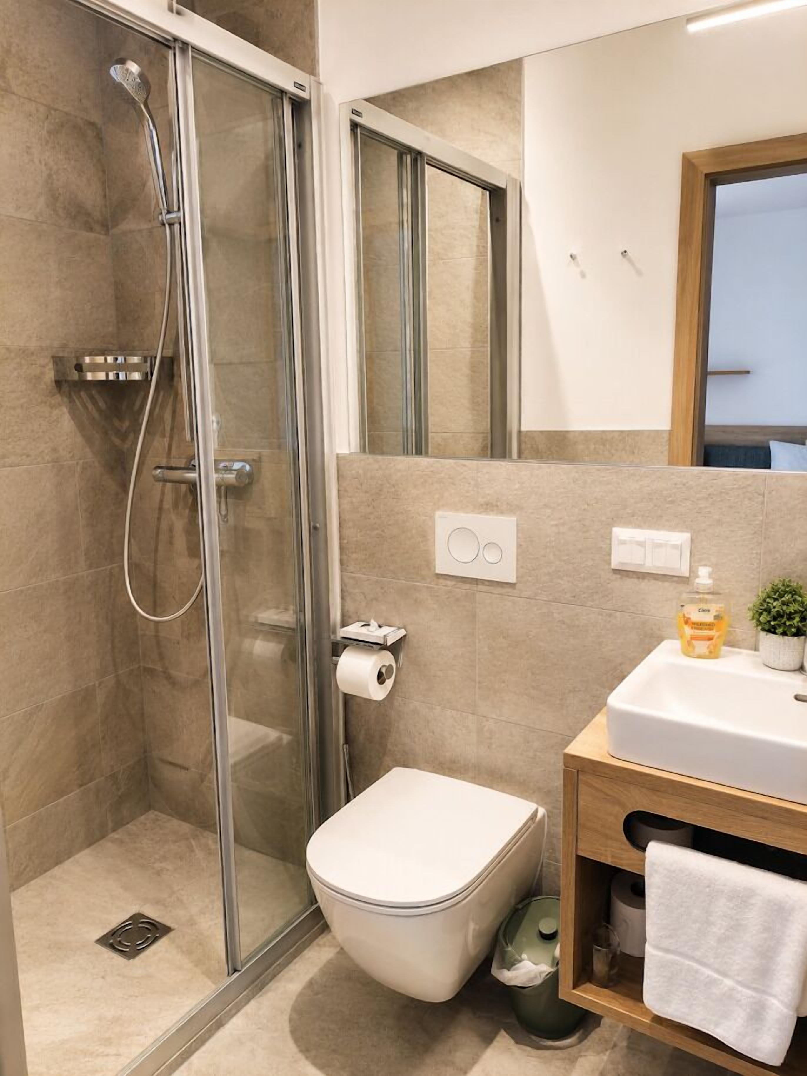Double Room, Balcony, Lake View | Bathroom | Shower, hair dryer, towels, soap