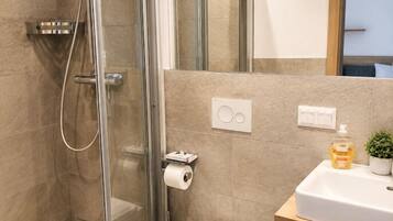 Double Room, Balcony, Lake View | Bathroom | Shower, hair dryer, towels, soap