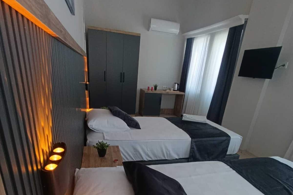 Family Quadruple Room, Balcony, City View | Desk, laptop workspace, free WiFi