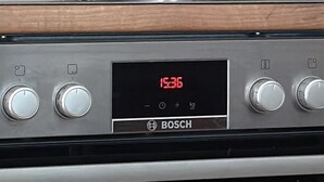 A Bosch oven with a digital clock displaying 15:36. - Comfort 1BR Studio Near Matzleinsdorfer (Vienna)