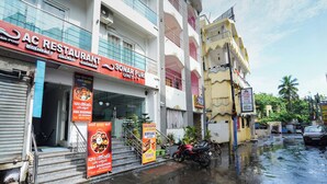 A multi-story building with a restaurant on the ground floor named AC Restaurant, offering Indian and Chinese cuisine. - Sonar Puri Unit 1 (Puri)