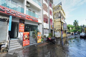 A multi-story building with a restaurant on the ground floor named AC Restaurant, offering Indian and Chinese cuisine. - Sonar Puri Unit 1 (Puri)