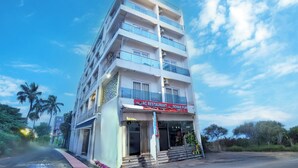 A multi-story building with a restaurant on the ground floor. - Sonar Puri Unit 1 (Puri)