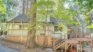 A wooden cabin with a staircase leading to a deck, surrounded by trees. - 4 Mi to State Park: Quiet Escape w/ Deck in Arnold (Arnold)