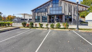 A building with a sign reading "Inside Five Brewing Co." It has a modern design with large windows and a covered outdoor area. - Between Restaurant & Brewery! Chic Perrysburg Apt (Perrysburg)