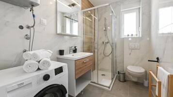 Shower, hair dryer, towels, toilet paper