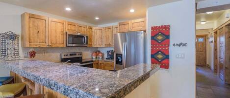 Coffee/tea maker, fridge, microwave, oven
