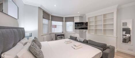 1 bedroom, desk, iron/ironing board, travel crib