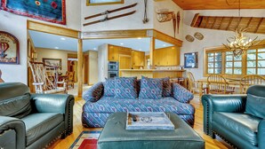 A spacious living room with a patterned sofa, leather armchairs, and a wooden ceiling. - CURRENTLY BEING REMODELED FOR THE 2026/2027 SEASON! NEW PHOTOS COMING SOON! (Deer Valley)