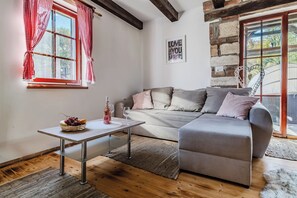 Family House, Multiple Bedrooms, Mountainside (Nature Lodge With Sauna and Hot Tub) | Living area | 21-inch Smart TV with cable channels, fireplace - Nature Lodge With Sauna and Hot Tub (Vidovec)