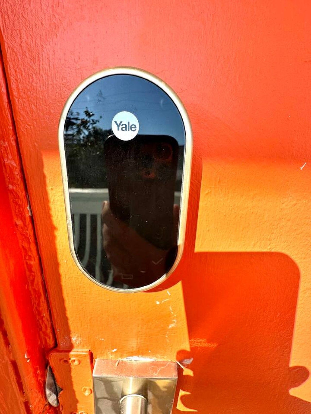 A Yale keycard on a door handle.