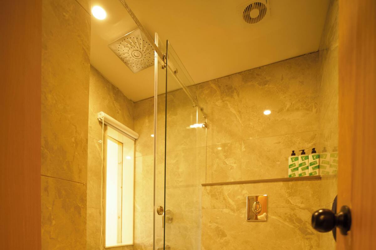 Luxury Studio Suite, Balcony, Mountain View | Bathroom | Shower, hair dryer, towels, soap