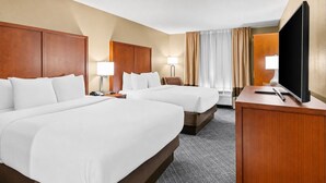 A hotel room with two beds, a desk, a TV, and a lamp. - Stay Near LSU & Tiger Stadium w/ Free Breakfast, Outdoor Pool, and Parking (Baton Rouge)