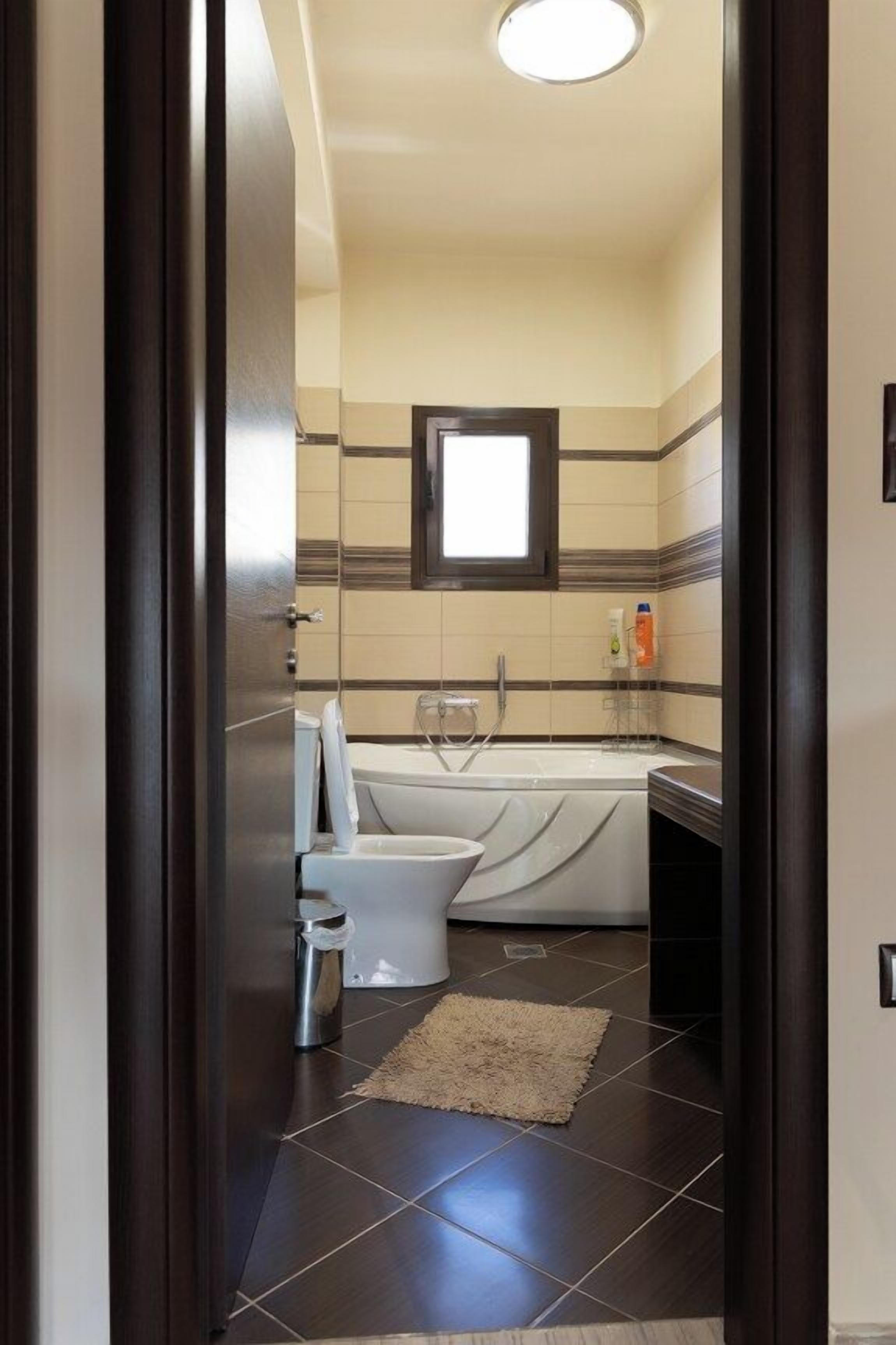 Bathroom View with Full Amenities
Another angle of the main bathroom showing the full vanity, large mirror, and well-organized layout — designed for both style and convenience.