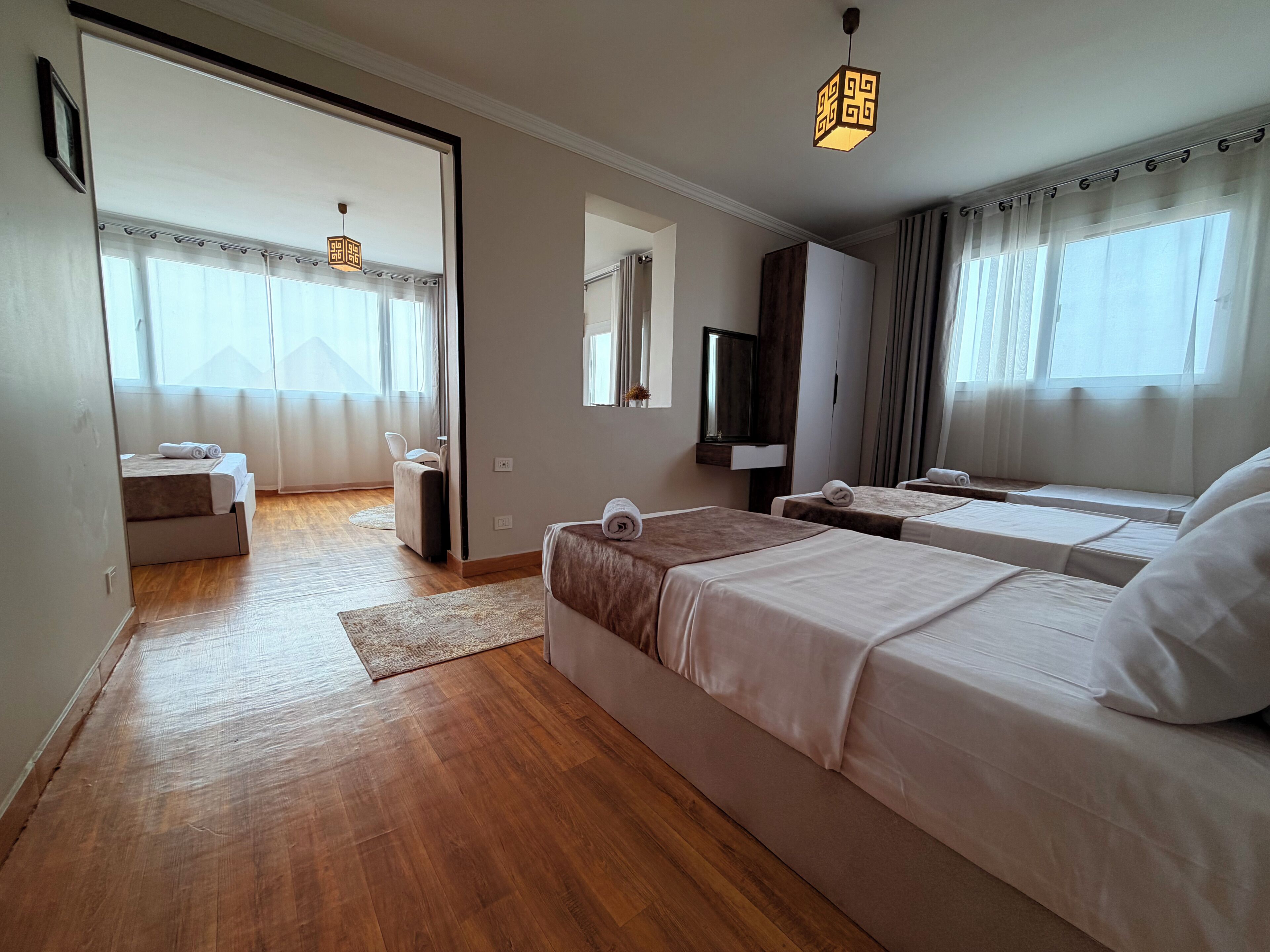 Family Triple Room, Mountain View | Laptop workspace, blackout drapes, soundproofing, iron/ironing board