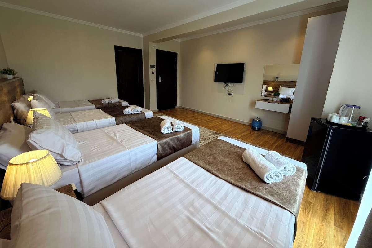 Family Quadruple Room, Patio, Mountain View | Laptop workspace, blackout drapes, soundproofing, iron/ironing board