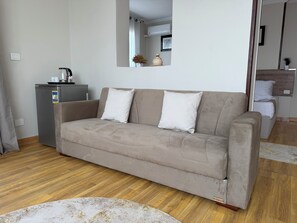 Family Triple Room, Mountain View | Living area - ra pyramids tower (Giza)