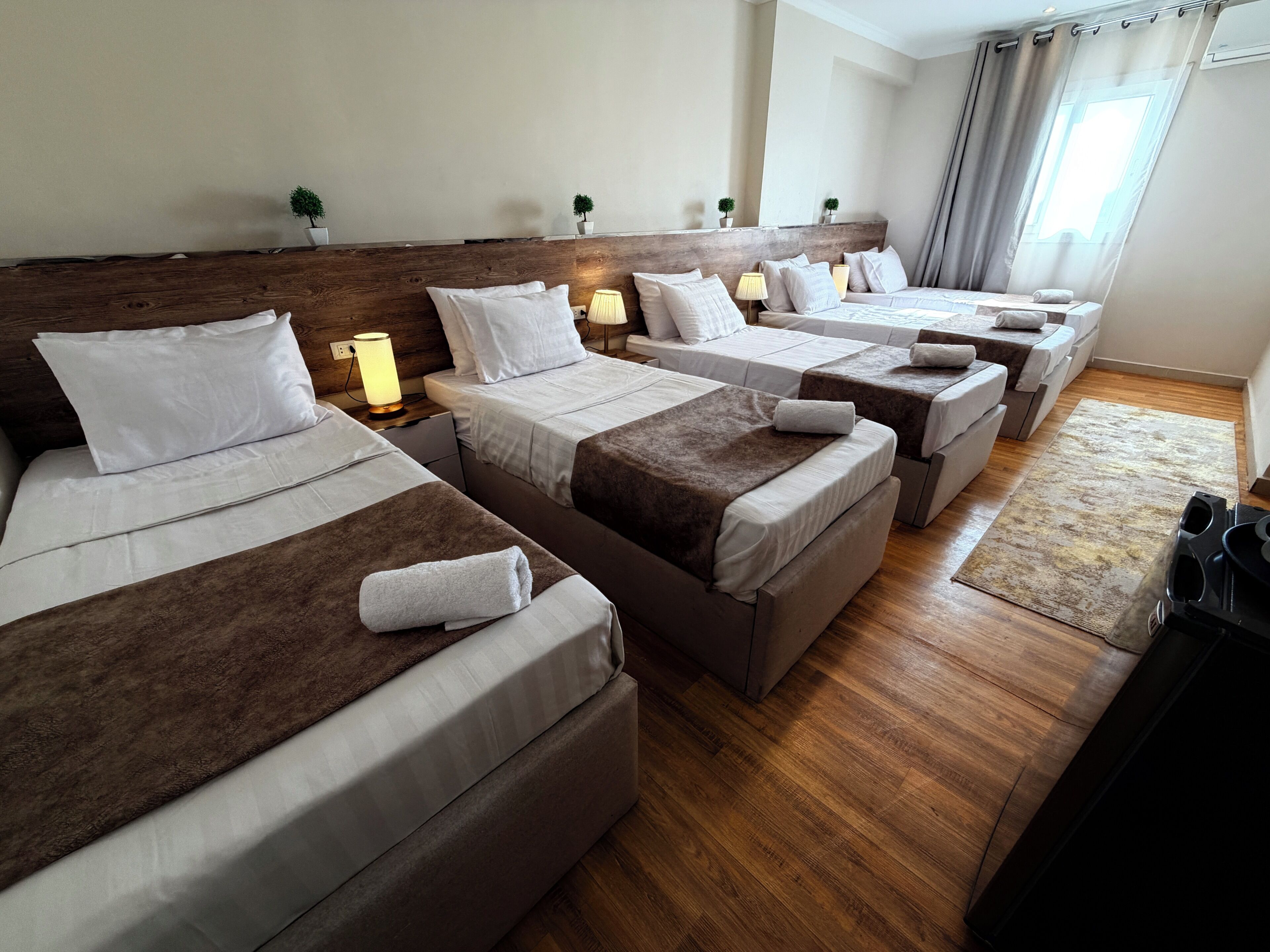 Deluxe Triple Room, Balcony, City View | Laptop workspace, blackout drapes, soundproofing, iron/ironing board