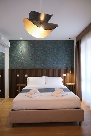 1 غرفة نوم وخزنة داخل الغرفة وواي فاي وملاءات أسرّة