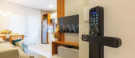 Deluxe Apartment | Living area | 50-inch Smart TV with digital channels