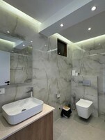 Comfort Triple Room, Balcony, Sea View | Bathroom | Bathrobes