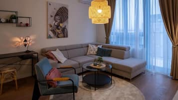 Deluxe Apartment, Garden View | Living area | 50-inch flat-screen TV with cable channels, Netflix, streaming services