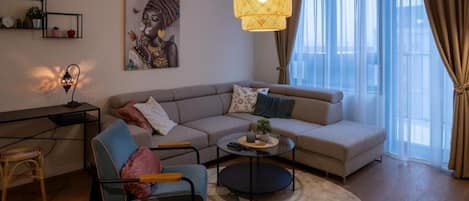 Deluxe Apartment, Garden View | Living area | 50-inch flat-screen TV with cable channels, Netflix, streaming services