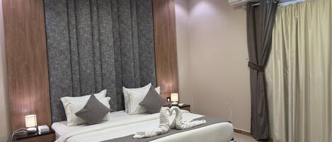 Deluxe suite | Verduisterende gordijnen, gratis wifi