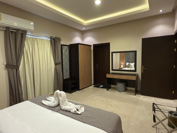 Deluxe suite | Verduisterende gordijnen, gratis wifi