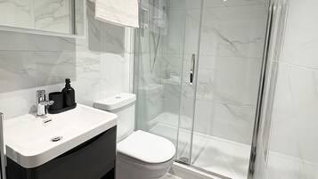 Shower, hair dryer, towels, soap