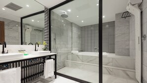 A modern bathroom with a glass-enclosed shower, a double sink vanity, and a large mirror. - Tres Reyes Pamplona (Pamplona)