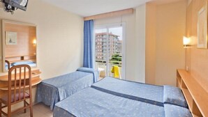 A hotel room with two beds, a desk, and a chair. - H Top Secret-roulette 4 Santa Susanna (Santa Susanna)
