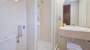 A modern bathroom with a glass-enclosed shower, a sink with a mirror, and a toilet. - H Top Secret-roulette 4 Santa Susanna (Santa Susanna)