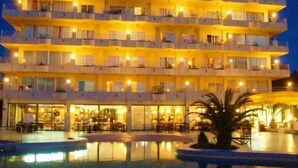 A multi-story hotel with balconies, a pool area, and a restaurant. - Bj Playa Blanca (Sant Llorenc des Cardassar)