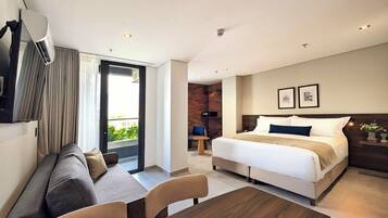 Deluxe Suite, Balcony | In-room safe, desk, blackout curtains, iron/ironing board