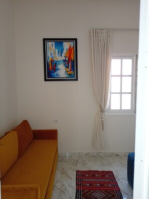 Family Quadruple Room, 1 King Bed with Sofa bed, Non Smoking | Living area