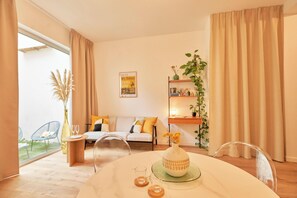 Apartment | Living area | 70-cm Smart TV with cable channels, TV - Chez Camille - Boutique Aparthotel (Bordeaux)