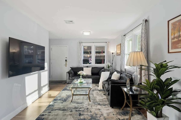 Bright, inviting living room—streaming with natural light and styled for cozy nights in or relaxed morning coffee.