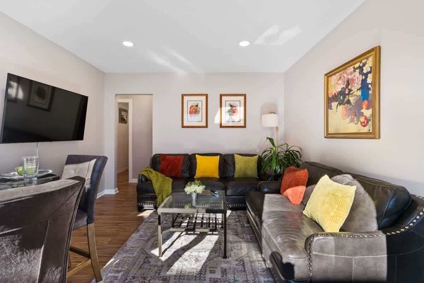 Vibrant and cozy living room—colorful accents and soft lighting set the tone for relaxed gatherings or quiet nights in.