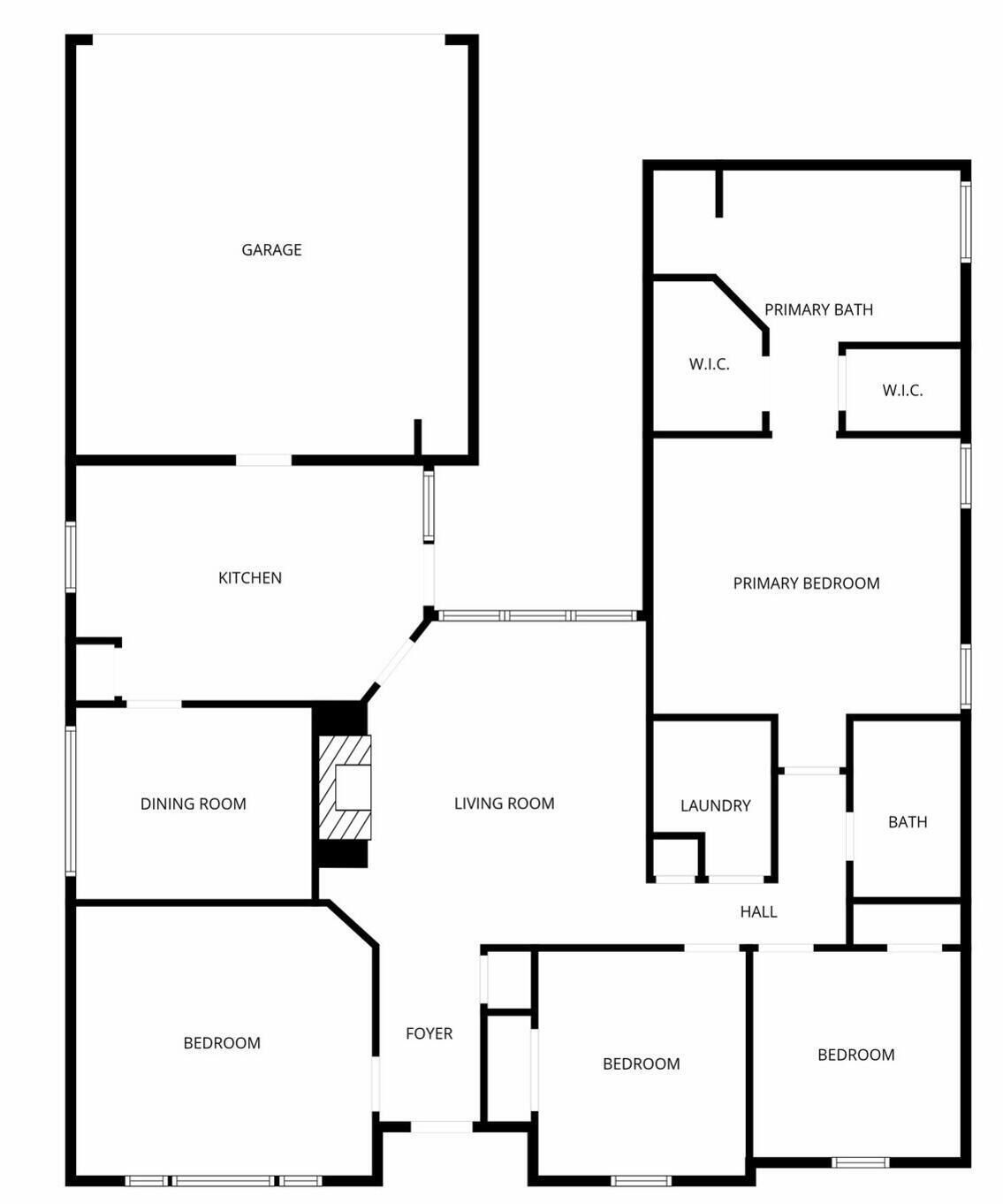 En planritning som visar ett garage, kök, matsal, vardagsrum, huvudsovrum, ett extra sovrum, badrum, tvättstuga, entréhall och ett badrum tillhörande huvudsovrummet.