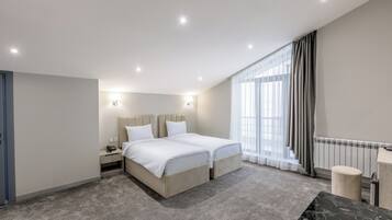 In-room safe, laptop workspace, blackout curtains, soundproofing