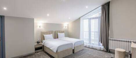 In-room safe, laptop workspace, blackout curtains, soundproofing