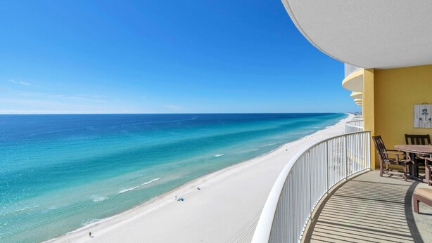 A balcony with a view of a beach and ocean. - Emerald Isle 1406 (Panama City Beach)
