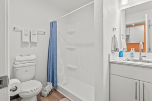 Shower, towels, soap, toilet paper