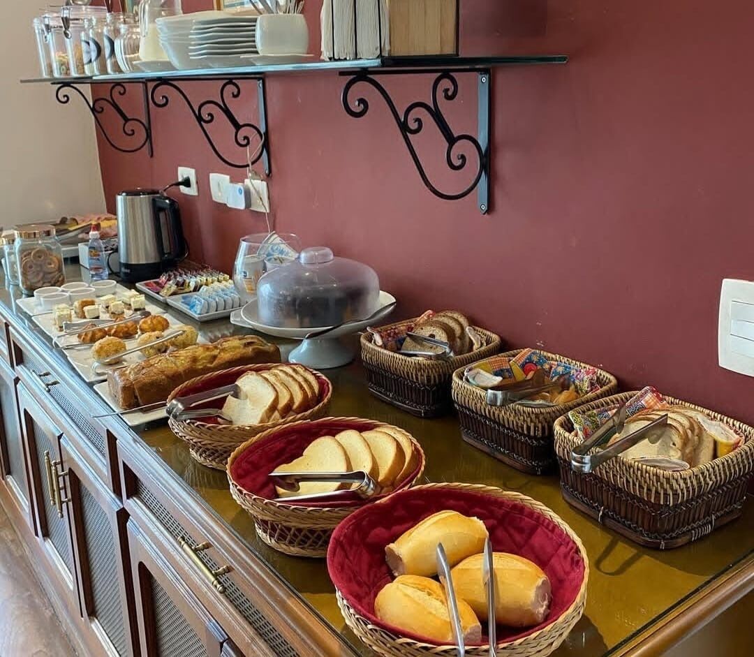 A buffet with various food items and utensils.