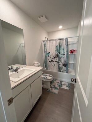 Shower, hair dryer, towels, soap - New Home in New Community Near Downtown Houston (Houston)